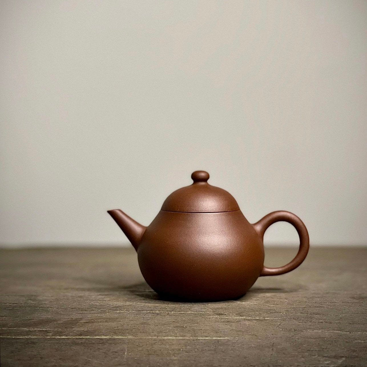 Purple clay teapot made by art master Dong Jinhua [Hei Xing Tu-Ba Le]